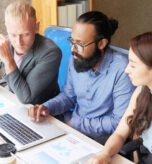 Business people sitting at office and developing new project with laptop